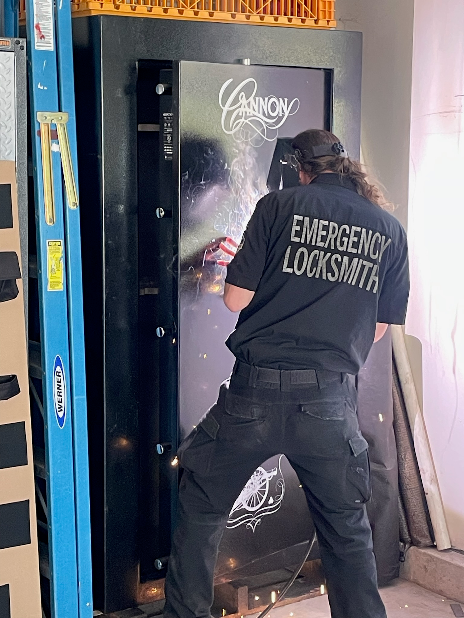 Emergency Locksmith technician working on a large Cannon safe