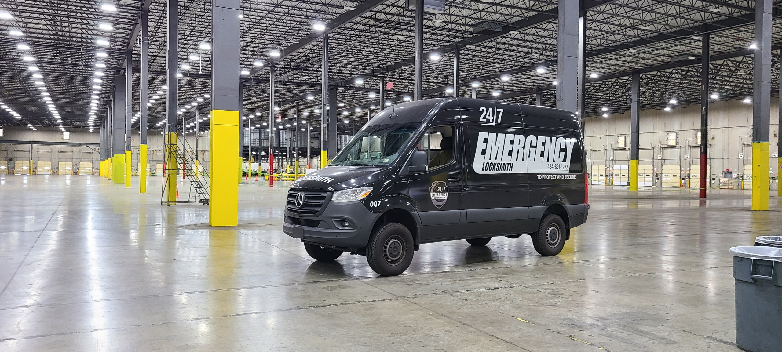 24/7 Emergency Locksmith service van parked inside a warehouse